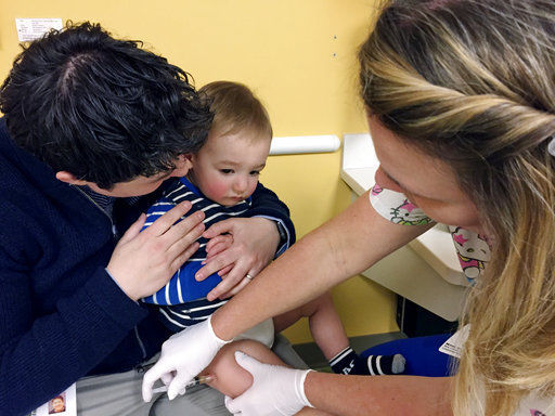 Baby gets measles vaccination